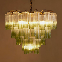 Chiara Chandelier by Soho Home. Multiple green ombre, scalloped glass tubular sections. Hand-finished by skilled artisans. Inspired by Soho Home.