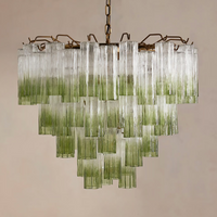 Chiara Chandelier by Soho Home. Multiple green ombre, scalloped glass tubular sections. Hand-finished by skilled artisans. Inspired by Soho Home.