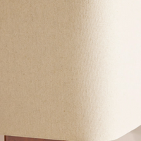 The Remi table lamp by Soho Home. Designed with a rectangular base in dark oak mappa burl timber. Complemented with a natural linen shade. Inspired by Soho House.