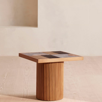 Cavern Side Table by Soho Home. A mix of travertine and honed Jade Shell, Golden Portoro and Grey Pesco marble with inlay pattern. Solid oak fluted base. Inspired by Soho House.