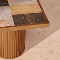 Cavern Side Table by Soho Home. A mix of travertine and honed Jade Shell, Golden Portoro and Grey Pesco marble with inlay pattern. Solid oak fluted base. Inspired by Soho House.