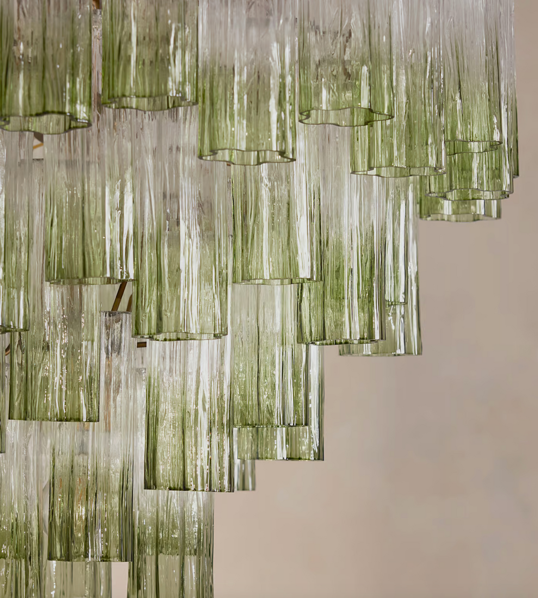 Chiara Chandelier by Soho Home. Multiple green ombre, scalloped glass tubular sections. Hand-finished by skilled artisans. Inspired by Soho Home.
