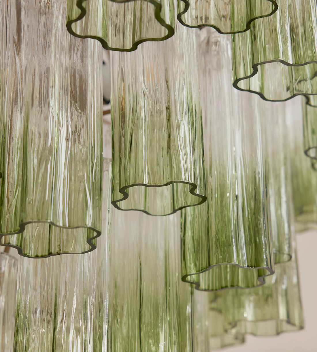 Chiara Chandelier by Soho Home. Multiple green ombre, scalloped glass tubular sections. Hand-finished by skilled artisans. Inspired by Soho Home.