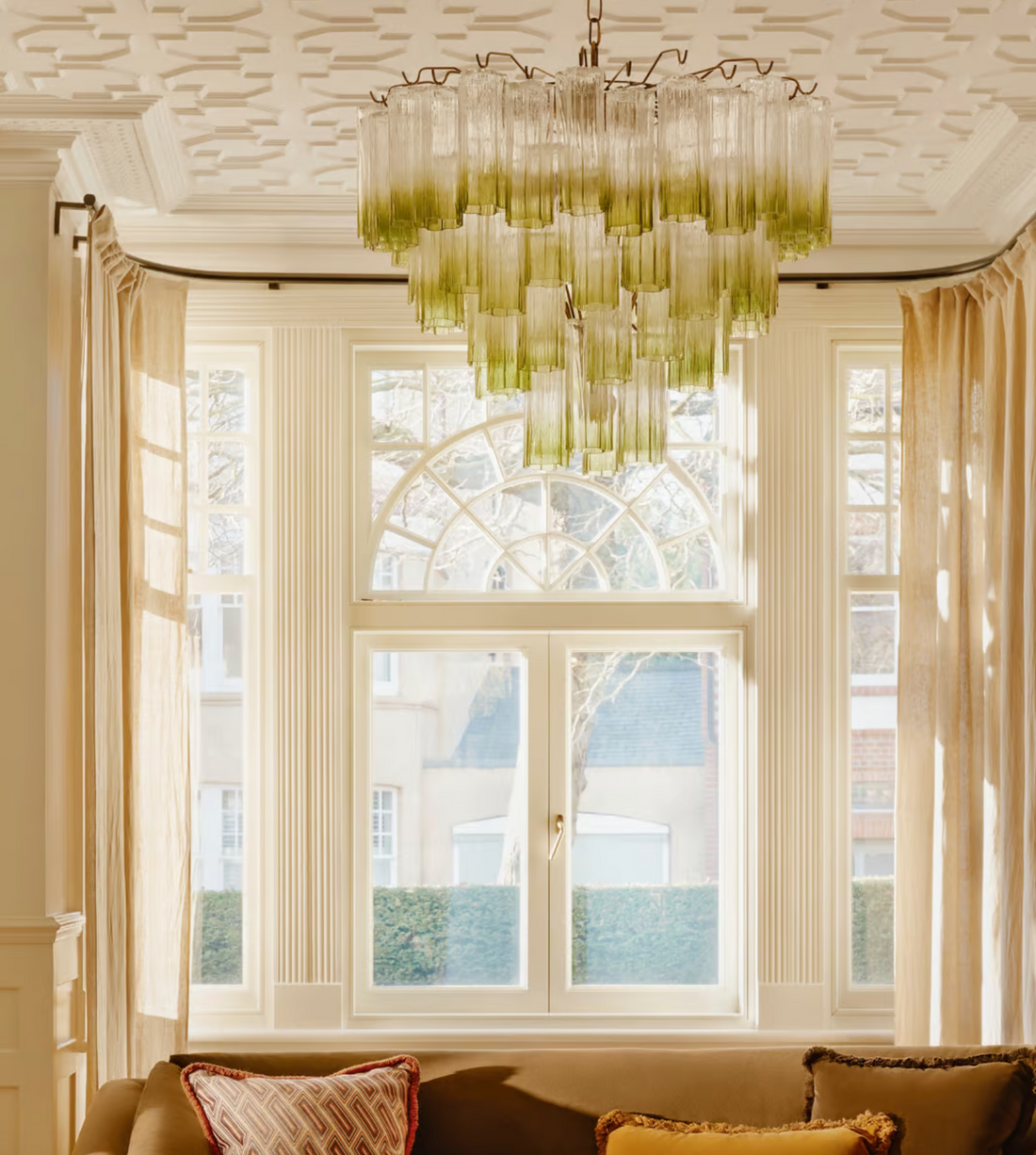 Chiara Chandelier by Soho Home. Multiple green ombre, scalloped glass tubular sections. Hand-finished by skilled artisans. Inspired by Soho Home.