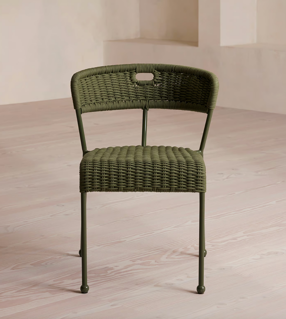 Lisson dining chairs by Soho Home  crafted using a bespoke hand-dyed woven rope suspension. Olive green colour and stackable design.