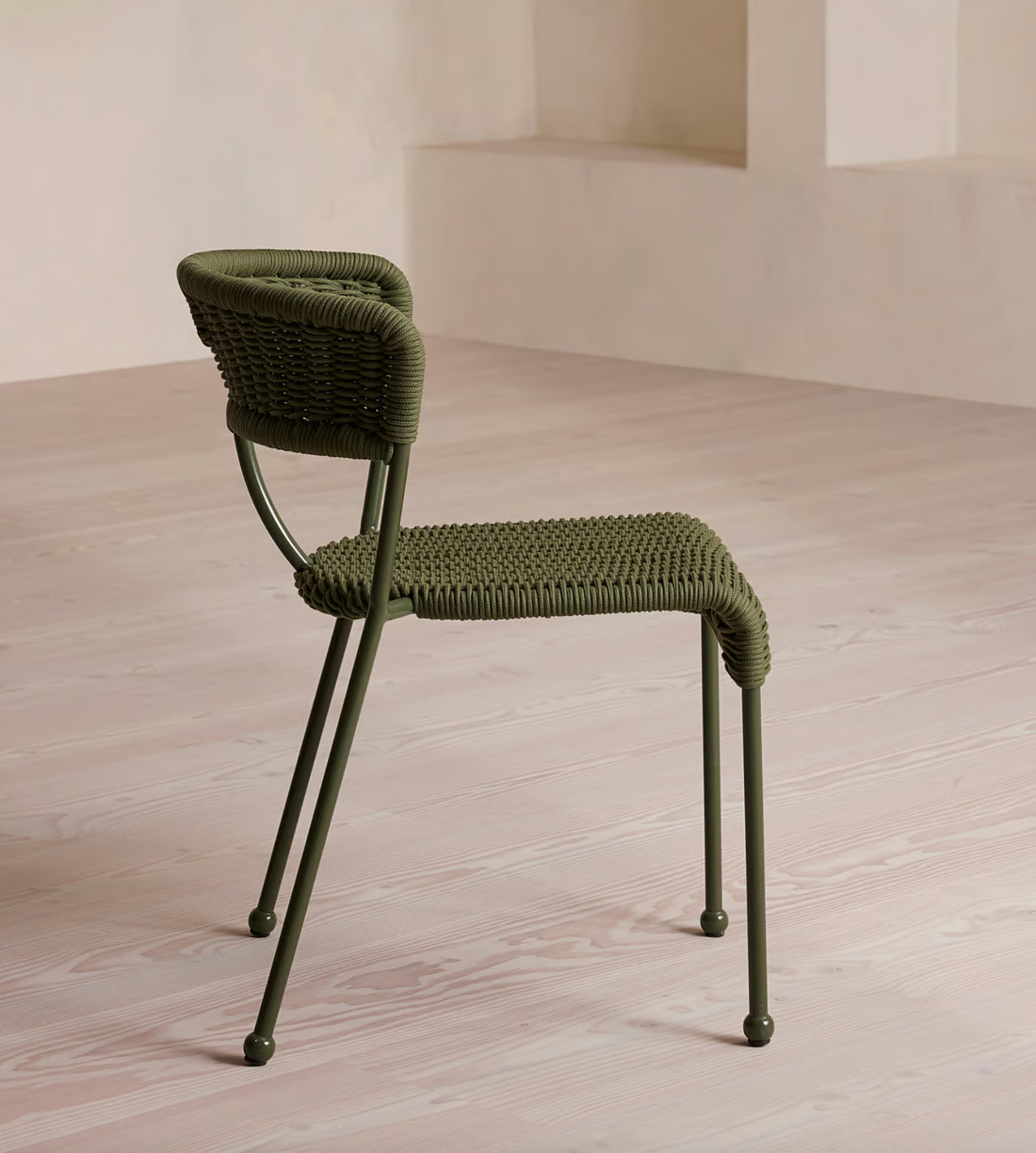Lisson dining chairs by Soho Home  crafted using a bespoke hand-dyed woven rope suspension. Olive green colour and stackable design.