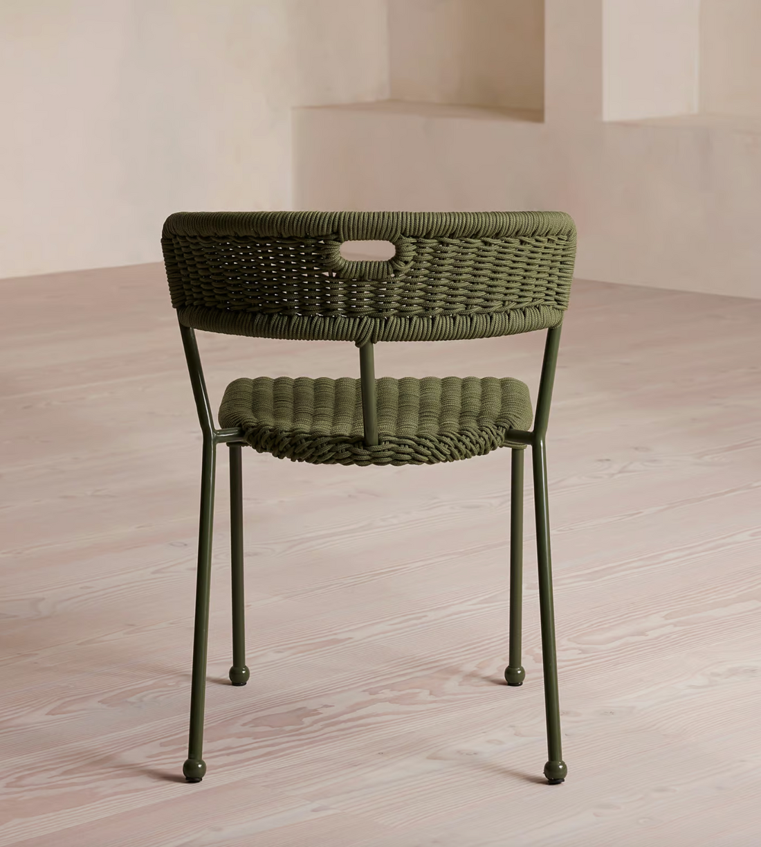 Lisson dining chairs by Soho Home  crafted using a bespoke hand-dyed woven rope suspension. Olive green colour and stackable design.
