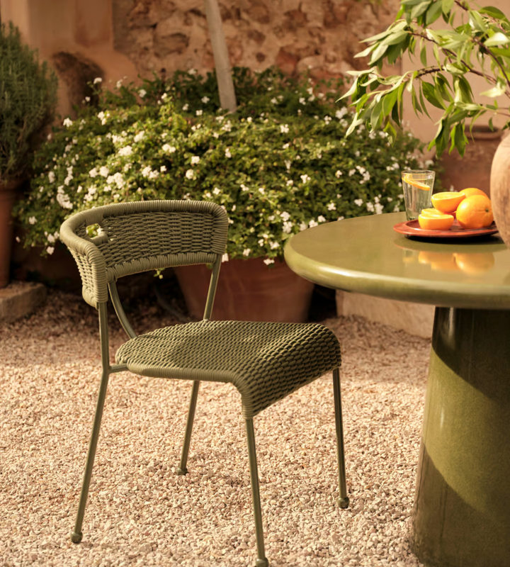 Lisson dining chairs by Soho Home  crafted using a bespoke hand-dyed woven rope suspension. Olive green colour and stackable design.