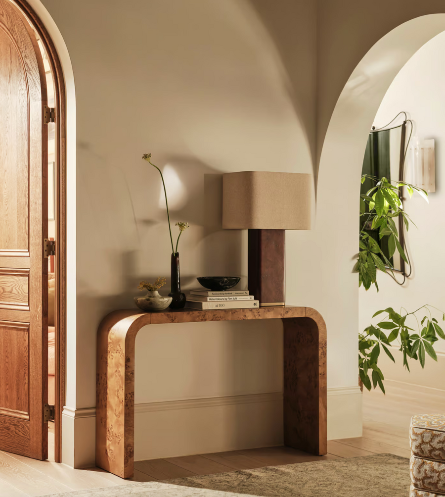 The Remi table lamp by Soho Home.  Designed with a rectangular base in dark oak mappa burl timber. Complemented with a natural linen shade. Inspired by Soho House.