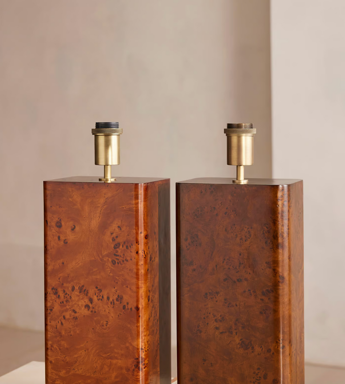 The Remi table lamp by Soho Home.  Designed with a rectangular base in dark oak mappa burl timber. Complemented with a natural linen shade. Inspired by Soho House.