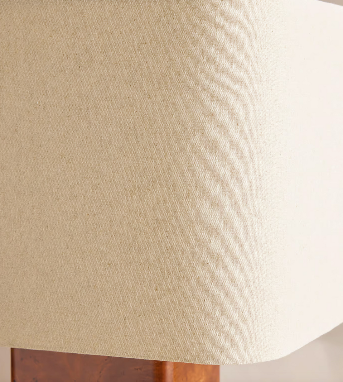 The Remi table lamp by Soho Home.  Designed with a rectangular base in dark oak mappa burl timber. Complemented with a natural linen shade. Inspired by Soho House.