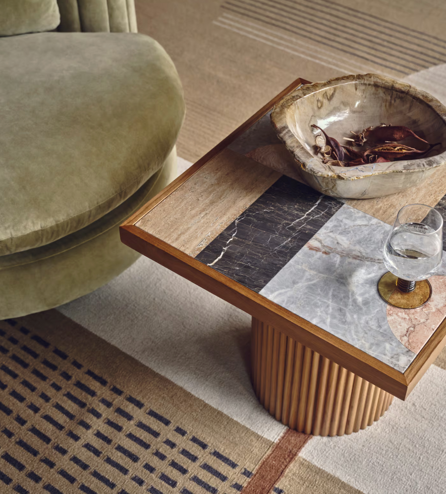 Cavern Side Table by Soho Home. A mix of travertine and honed Jade Shell, Golden Portoro and Grey Pesco marble with inlay pattern. Solid oak fluted base. Inspired by Soho House.