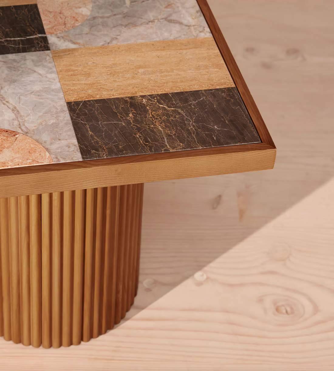 Cavern Side Table by Soho Home. A mix of travertine and honed Jade Shell, Golden Portoro and Grey Pesco marble with inlay pattern. Solid oak fluted base. Inspired by Soho House.