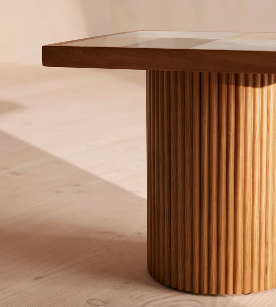 Cavern Side Table by Soho Home. A mix of travertine and honed Jade Shell, Golden Portoro and Grey Pesco marble with inlay pattern. Solid oak fluted base. Inspired by Soho House.